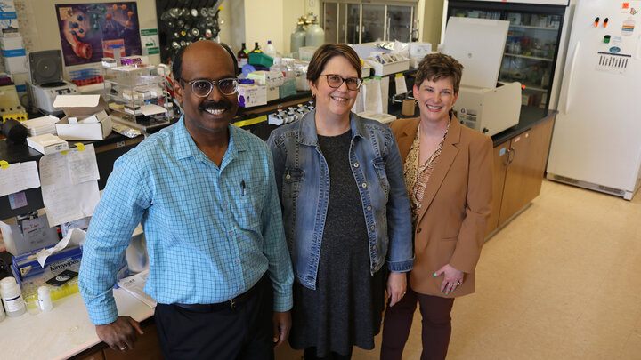 Sathish Kuman Natarajan, Jennifer Wood and Amanda Ramer-Tait pose for a group photo in Sathish's research lab. Photo by Eric Buck, Animal Science